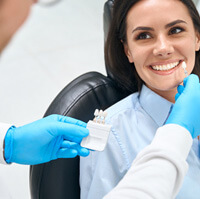 Woman smiling at the dentist’s office 