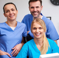 Dental team working together and smiling  