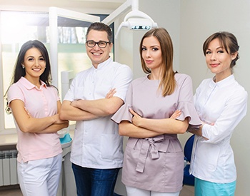 Dental team of four smiling